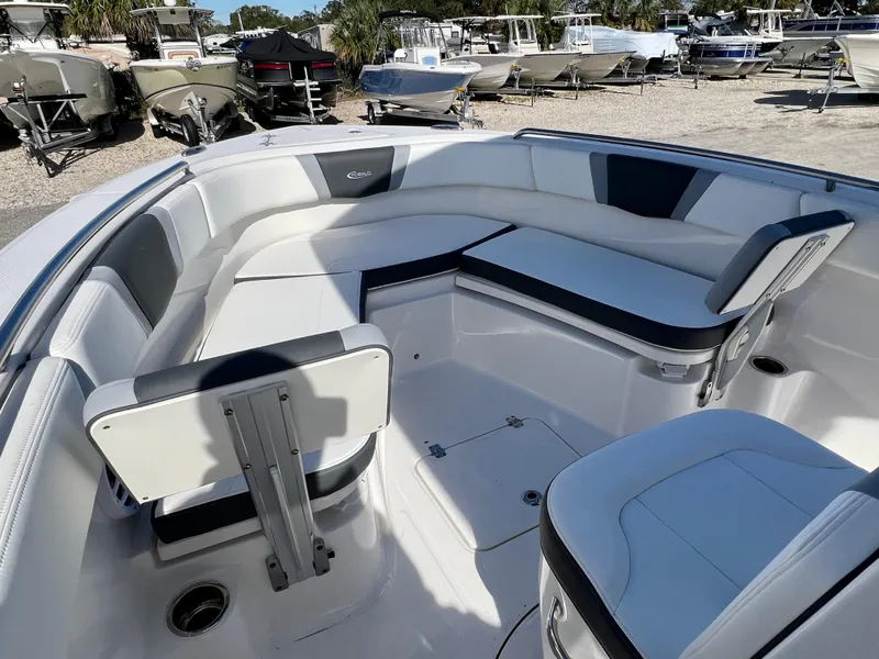 Slide: The Image of 2024 Robalo R230 boat interior with white and black seating. - 24