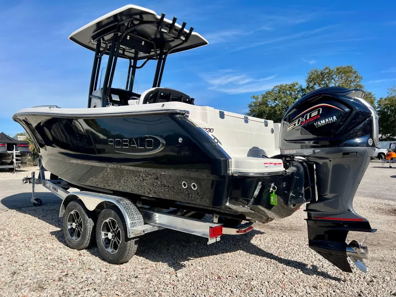 Slide: The Image of 2024 Robalo R230 boat on trailer with Yamaha outboard motor. - 3