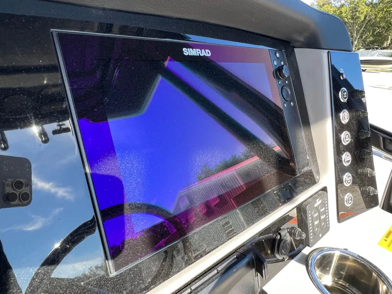 Slide: The Image of Simrad display on the 2024 Robalo R230 boat dashboard. - 37