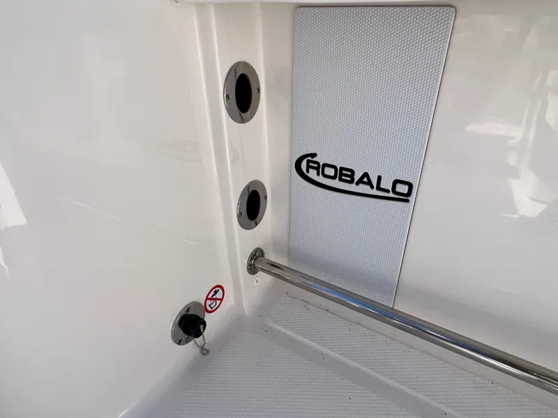 Slide: The Image of 2024 Robalo R230 boat interior with logo and fittings. - 40