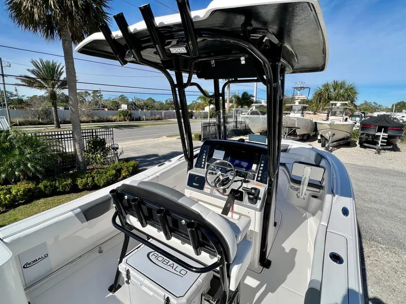 Slide: The Image of 2024 Robalo R230 boat interior with helm station and seating. - 9