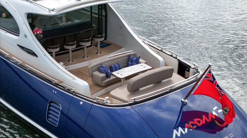 Slide: The Image of 2023 Zeelander 72 yacht with luxurious seating and dining area on the deck. - 19