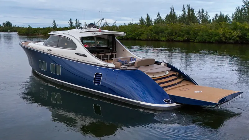 Slide: The Image of 2023 Zeelander 72 luxury yacht cruising on a serene waterway. - 27