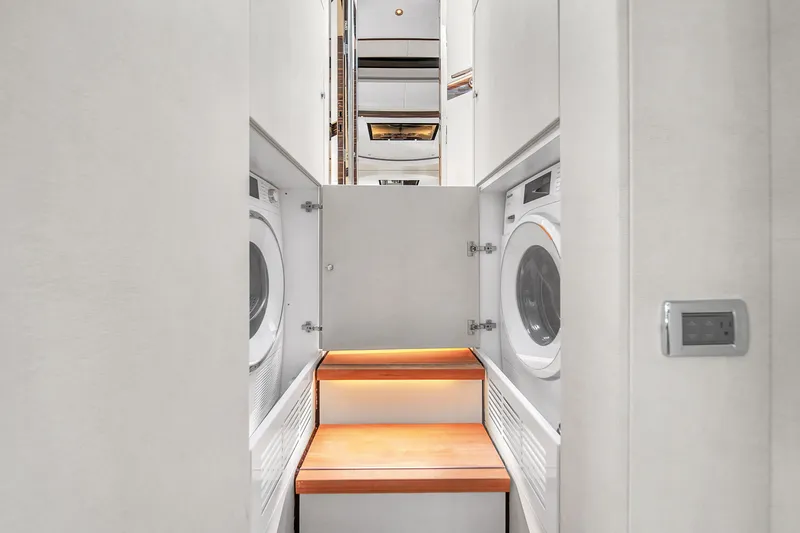 Slide: The Image of Laundry area with washer and dryer in 2023 Zeelander 72 yacht. - 30