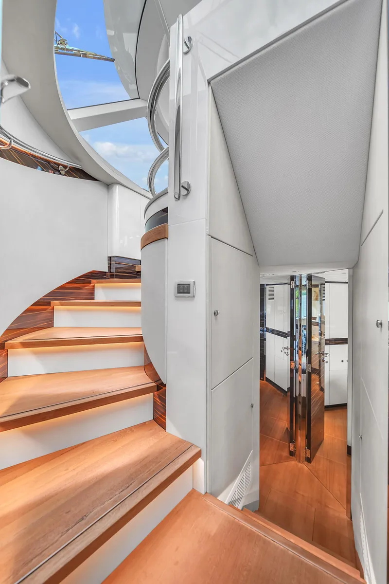 Slide: The Image of Interior staircase of 2023 Zeelander 72 yacht with modern design and wooden steps. - 31