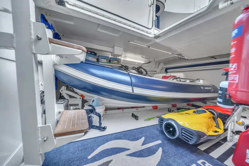 Slide: The Image of Storage area of 2023 Zeelander 72 yacht with inflatable boat and equipment. - 41