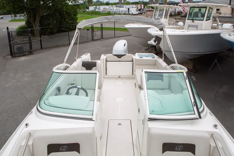 Slide: The Image of 2024 Sailfish 226 DC boat with dual consoles and spacious seating. - 16