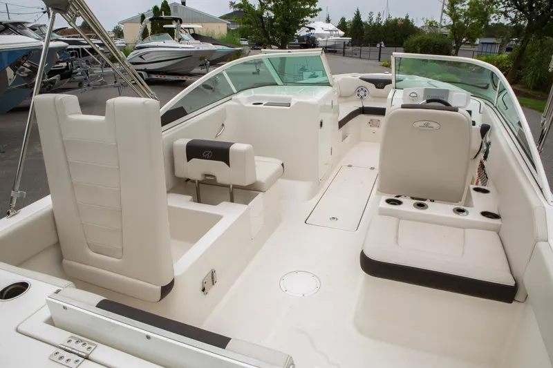 Slide: The Image of 2024 Sailfish 226 DC boat interior with seating and steering console. - 22