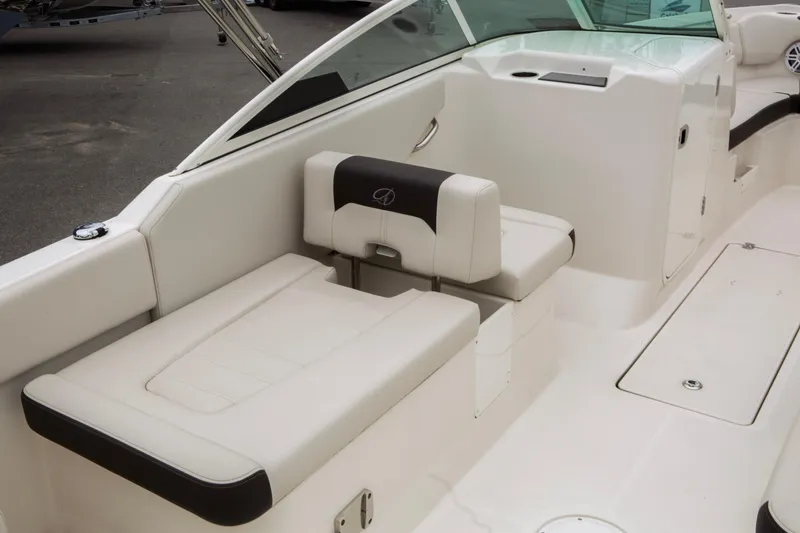 Slide: The Image of 2024 Sailfish 226 DC boat interior with white seating and sleek design. - 24