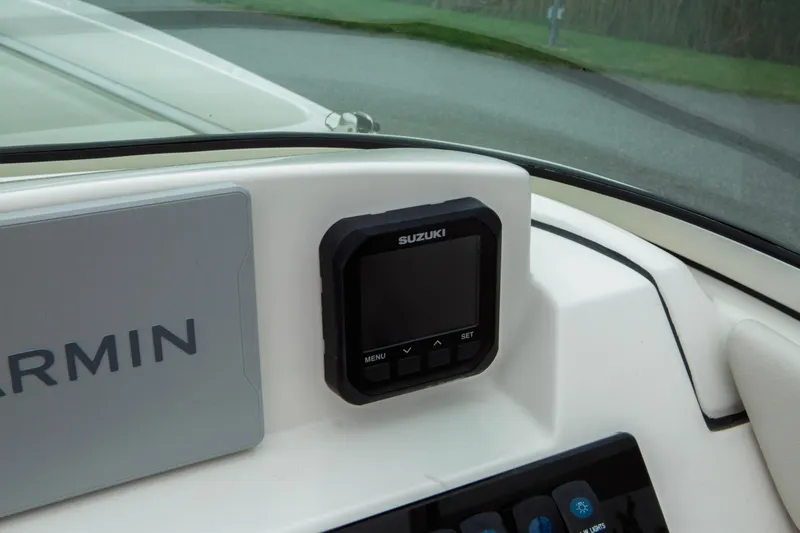 Slide: The Image of Dashboard of 2024 Sailfish 226 DC boat with Garmin and Suzuki displays. - 8