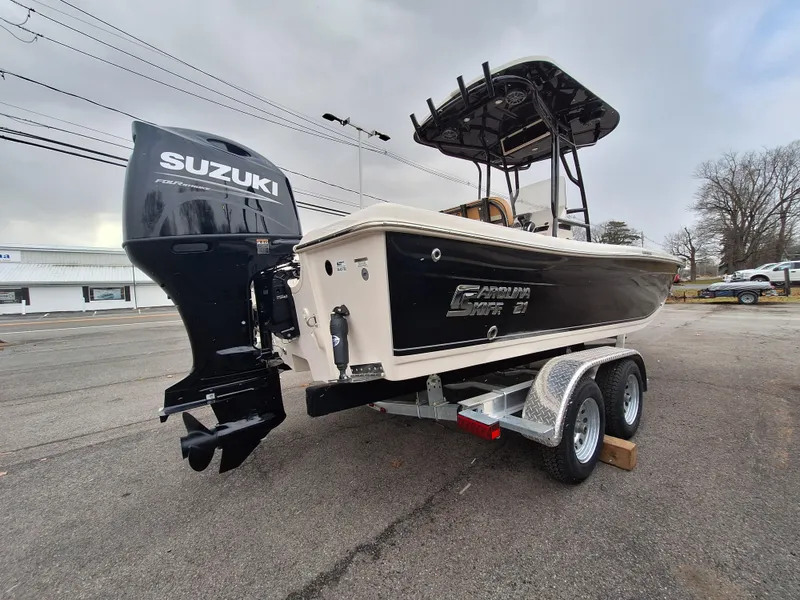 Slide: The Image of 2023 Carolina Skiff 21 Ultra Elite boat with Suzuki outboard motor on trailer. - 4