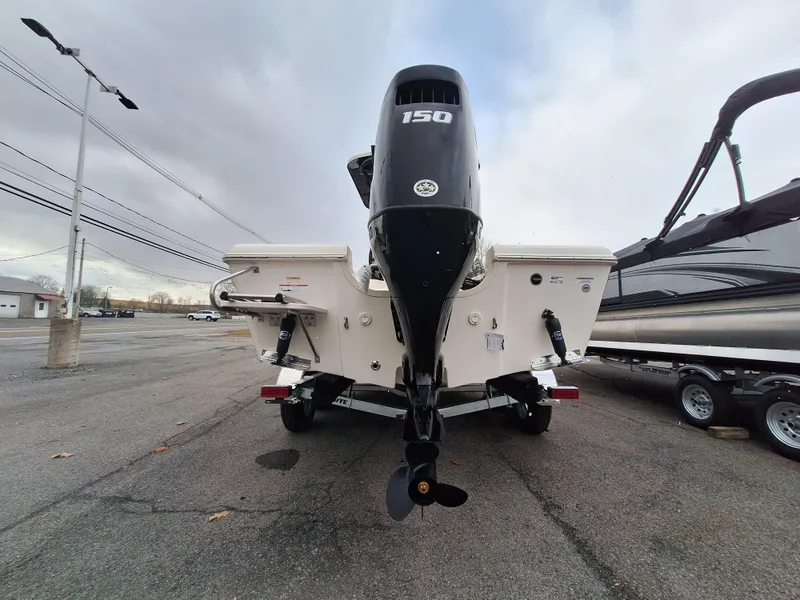 Slide: The Image of 2023 Carolina Skiff 21 Ultra Elite boat with 150 HP outboard motor. - 5