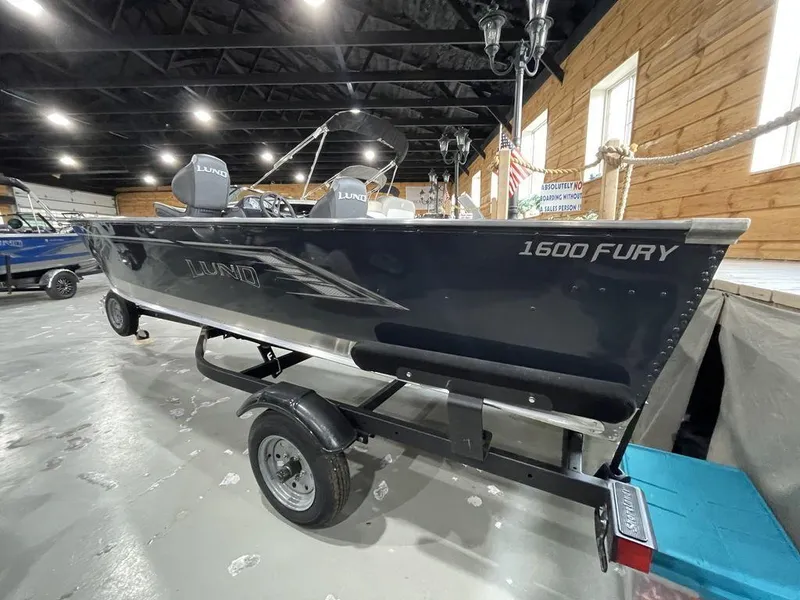 Slide: The Image of 2024 Lund Fury 1600 SS fishing boat on trailer in showroom. - 12