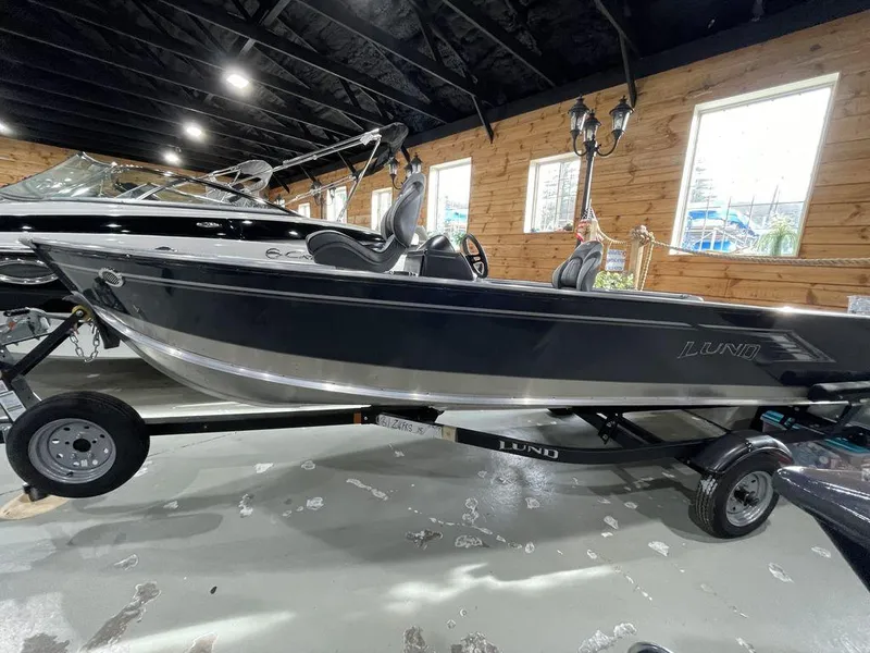Slide: The Image of 2024 Lund Fury 1600 SS fishing boat on trailer in showroom. - 3