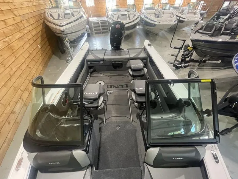 Slide: The Image of 2024 Lund Crossover XS 1875 boat interior in showroom. - 14