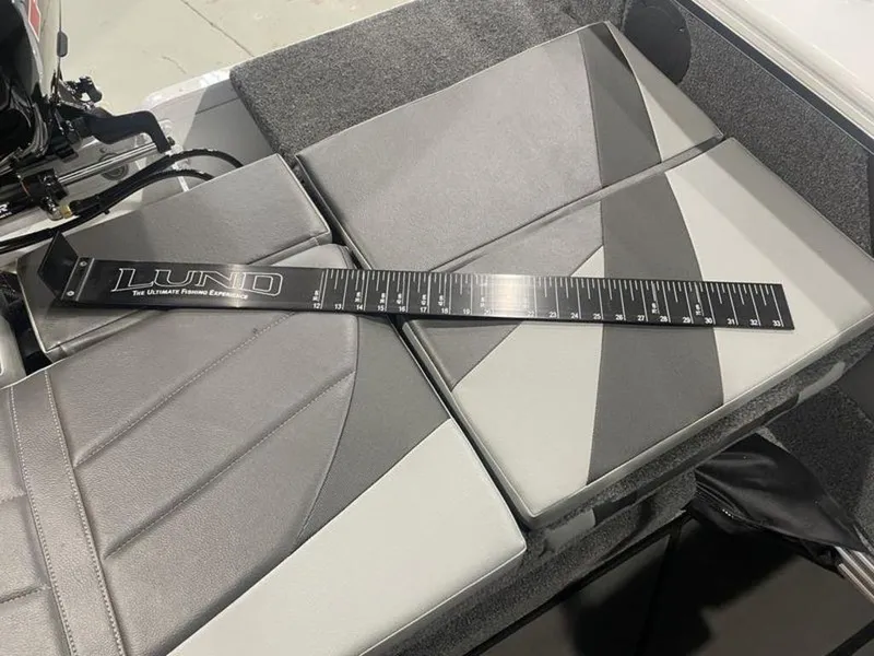 Slide: The Image of 2024 Lund Crossover XS 1875 boat interior with measuring ruler on seats. - 16