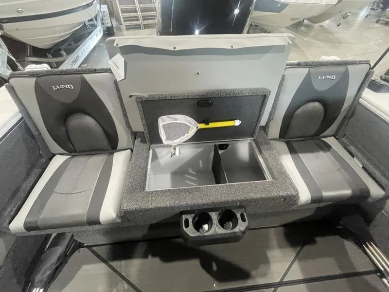 Slide: The Image of 2024 Lund Crossover XS 1875 boat interior with storage compartment and seating. - 8