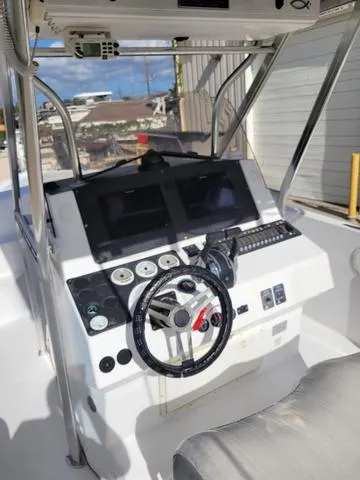 Slide: The Image of 1998 Donzi 35 ZF boat cockpit with modern controls and steering wheel. - 10