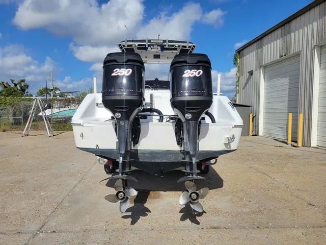 Slide: The Image of 1998 Donzi 35 ZF boat with twin 250 horsepower outboard engines, parked outdoors. - 3