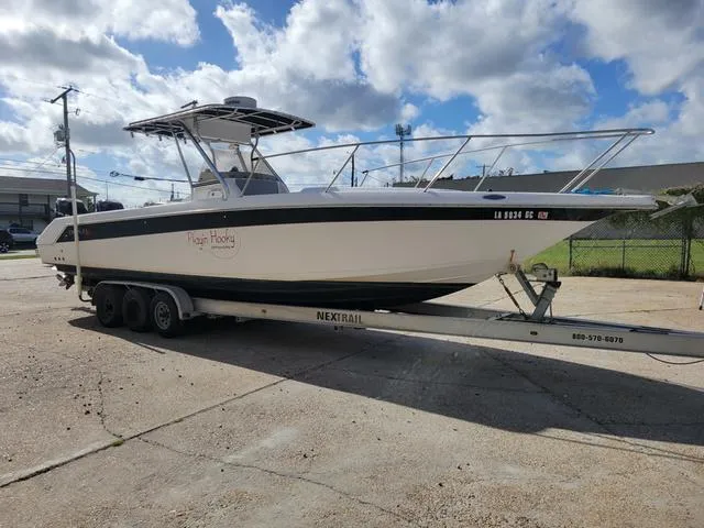 Slide: The Image of 1998 Donzi 35 ZF boat on trailer under cloudy sky. - 5