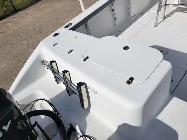 Slide: The Image of 1998 Donzi 35 ZF boat deck with storage compartments and ladder. - 6
