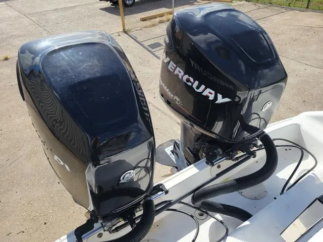 Slide: The Image of Twin Mercury outboard engines on a 1998 Donzi 35 ZF boat. - 7