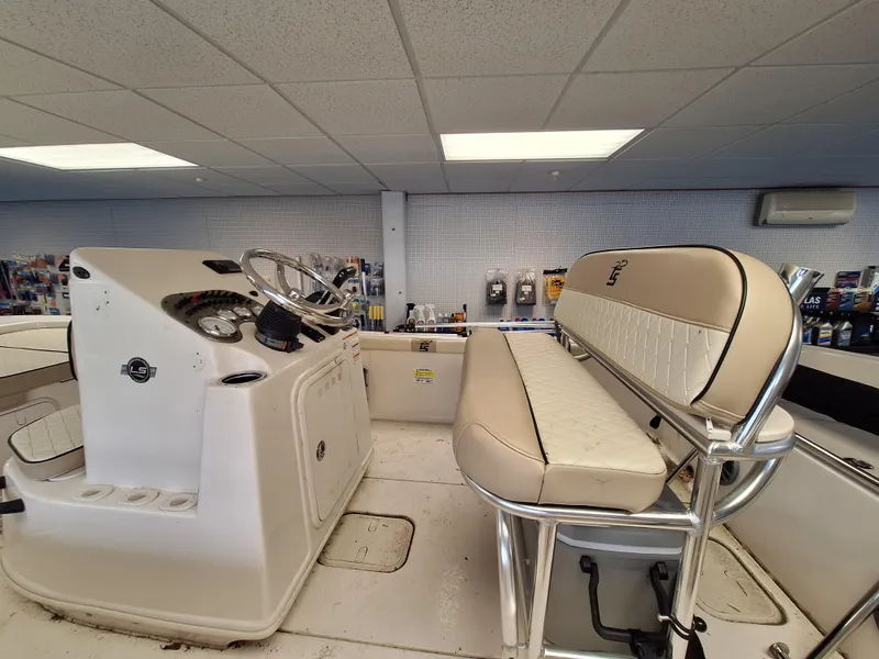 Slide: The Image of 2023 Carolina Skiff 19 LS boat interior with helm and seating. - 6