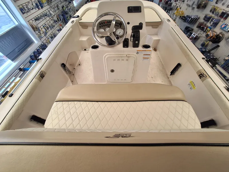 Slide: The Image of 2023 Carolina Skiff 19 LS boat interior with steering console and seating. - 7