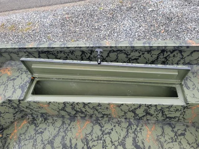 Slide: The Image of 2024 Edge Duck Boats 653DB storage compartment with camo pattern. - 12