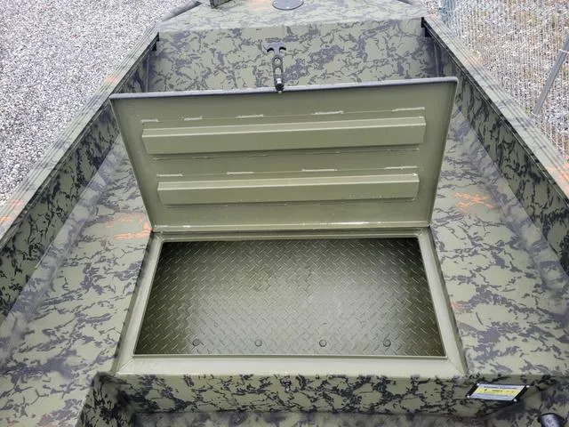 Slide: The Image of 2024 Edge Duck Boats 653DB open storage compartment with camouflage design. - 13