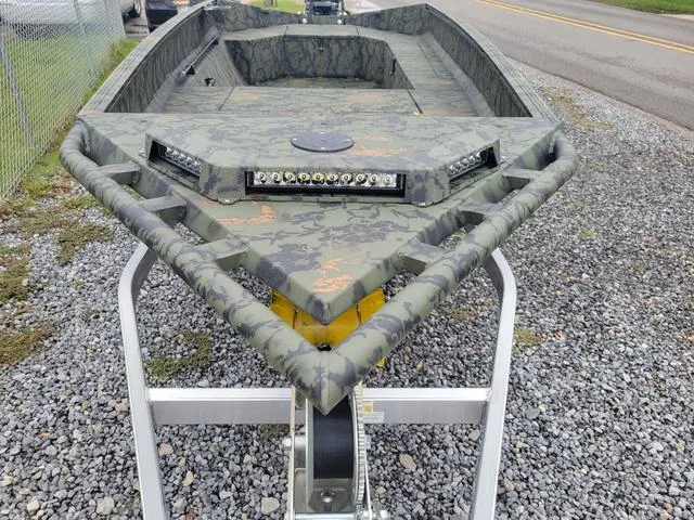 Slide: The Image of 2024 Edge Duck Boats 653DB camo-patterned boat on a trailer. - 5