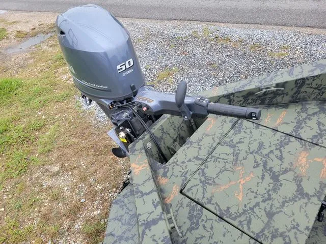 Slide: The Image of 2024 Edge Duck Boats 653DB with 50HP outboard motor, camo design. - 7