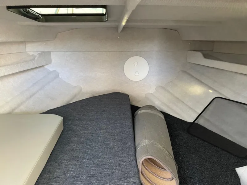 Slide: The Image of Interior cabin of 2024 KingFisher 2725 Weekender boat, featuring cozy sleeping area. - 14