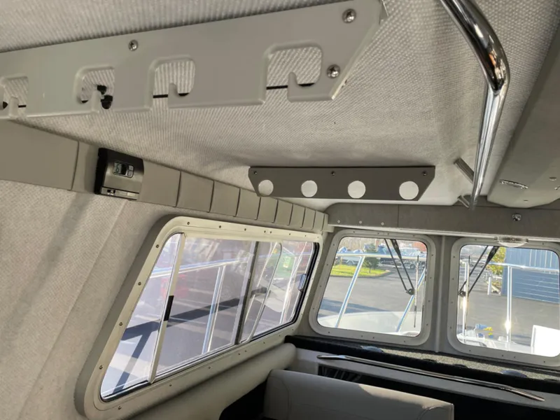 Slide: The Image of Interior of 2024 KingFisher 2725 Weekender boat with windows and ceiling details. - 21