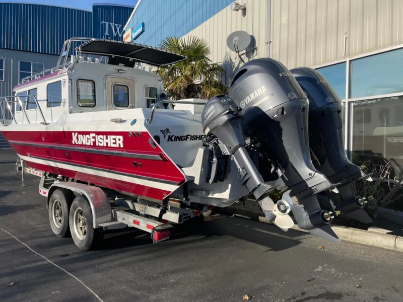 Slide: The Image of 2024 KingFisher 2725 Weekender boat with dual Yamaha engines on a trailer. - 3