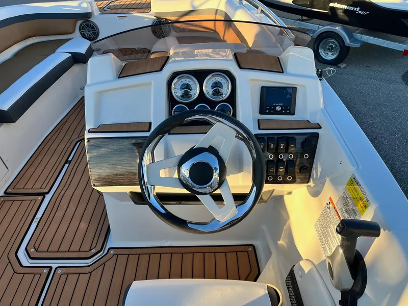 Slide: The Image of 2024 Starcraft SVX 191 boat dashboard with steering wheel and control panel. - 6