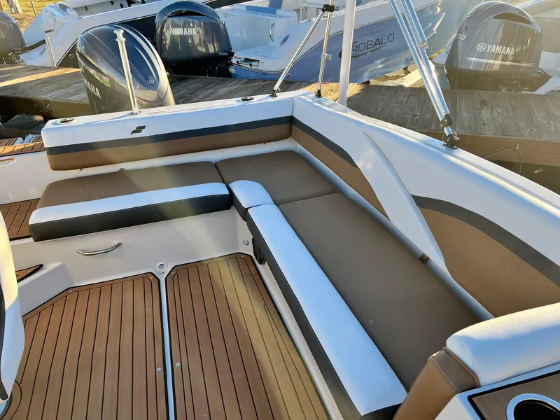 Slide: The Image of 2024 Starcraft SVX 191 boat interior with cushioned seating and wooden flooring. - 9