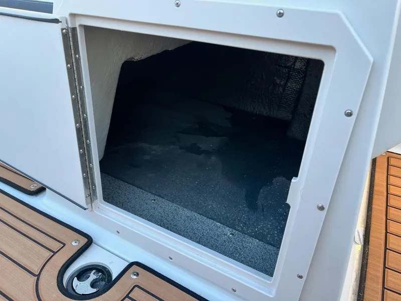 Slide: The Image of 2024 Starcraft SVX 191 boat storage compartment with open hatch. - 13