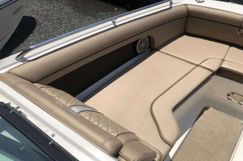 Slide: The Image of 2017 Sea Ray SDX 270 boat interior with beige seating and speaker. - 19