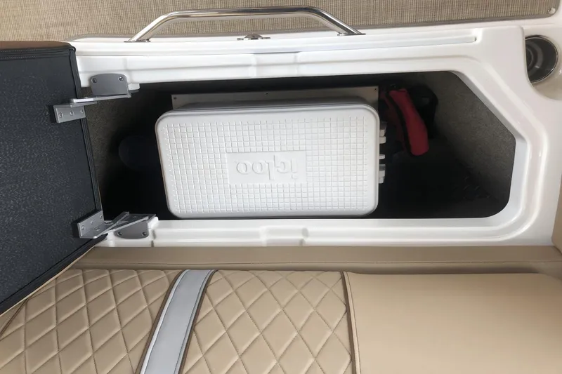 Slide: The Image of 2017 Sea Ray SDX 270 storage compartment with Igloo cooler and quilted seat. - 23