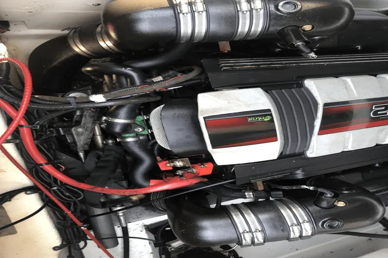 Slide: The Image of Engine of a 2017 Sea Ray SDX 270 boat, featuring detailed components and wiring. - 37