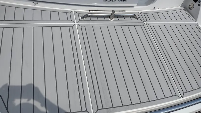 Slide: The Image of 2026 Formula 330 CBR boat deck with sleek, modern design and stainless steel handle. - 14