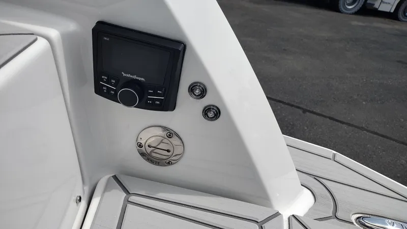 Slide: The Image of 2026 Formula 330 CBR boat dashboard with control panel and waste compartment. - 15
