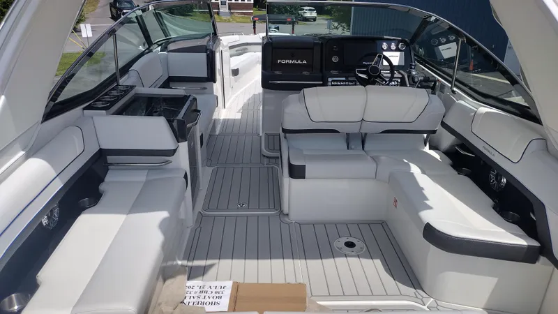 Slide: The Image of 2026 Formula 330 CBR boat interior with luxurious white seating and modern dashboard. - 17