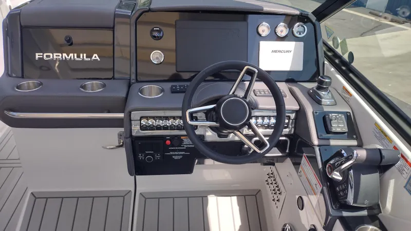 Slide: The Image of 2026 Formula 330 CBR boat dashboard with steering wheel and control panel. - 18