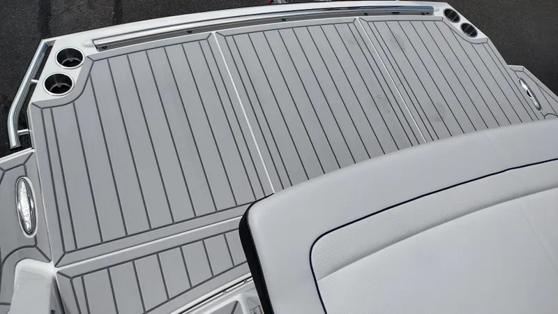 Slide: The Image of 2026 Formula 330 CBR boat deck with sleek gray finish and cup holders. - 19