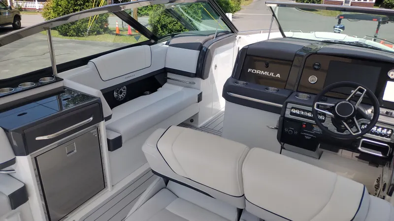 Slide: The Image of 2026 Formula 330 CBR boat interior with modern dashboard and luxurious seating. - 22