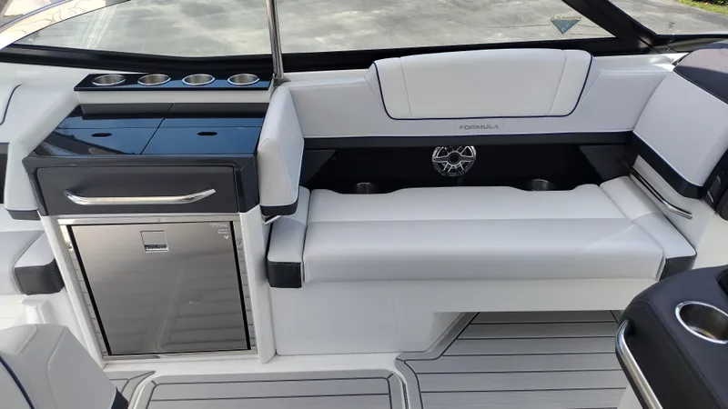 Slide: The Image of 2026 Formula 330 CBR boat interior with sleek seating and modern amenities. - 24