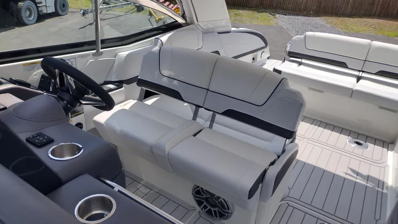 Slide: The Image of 2026 Formula 330 CBR boat interior with luxurious seating and modern steering console. - 32