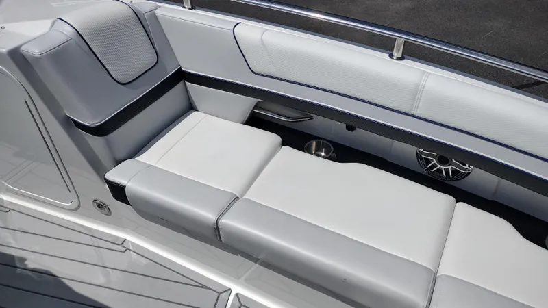 Slide: The Image of 2026 Formula 330 CBR boat interior with sleek white seating and modern design. - 34